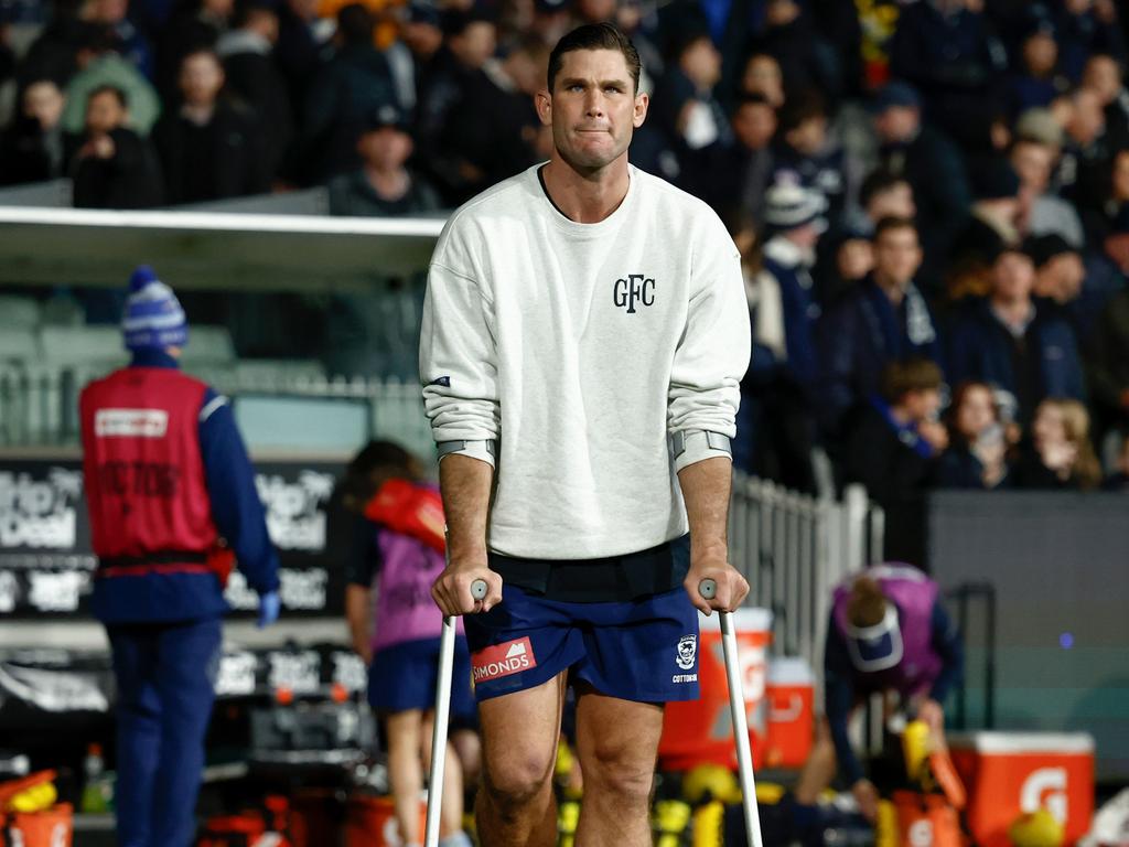 Tom Hawkins on crutches post game. Picture: Getty Images