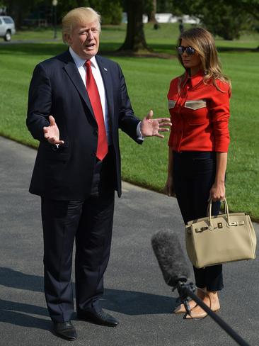 SEPTEMBER 10: Even “dressed down”, the First Lady made a fashion statement in a Calvin Klein shirt, teamed with jeans, mirrored Saint Laurent sunglasses and a Hermes Birkin bag. She was at the White House as the President addressed the media about Hurricane Irma. Picture: AFP