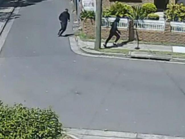 The two gunman fleeing the scene of the shooting in Rockdale. Picture: 7 News