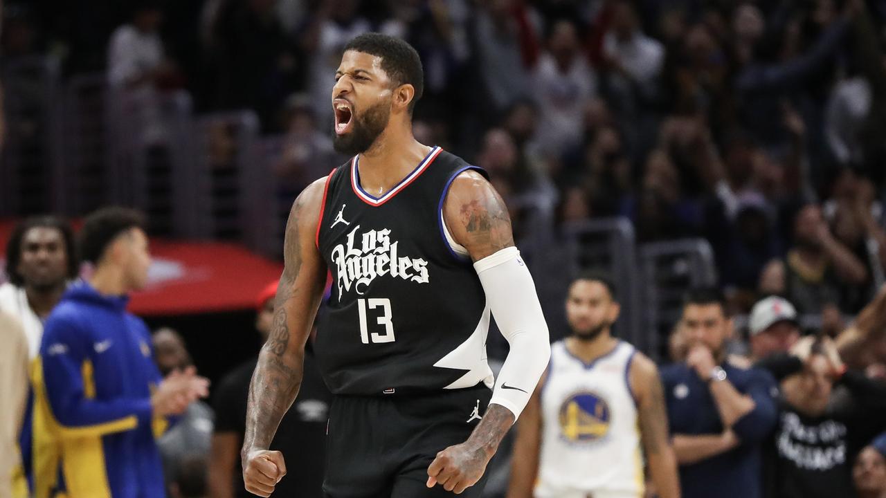 Paul George #13 of the LA Clippers reacts to his shot in the end of the fourth quarter against the Golden State Warriors at Crypto.com Arena on December 02, 2023 in Los Angeles, California. (Photo by Meg Oliphant/Getty Images)