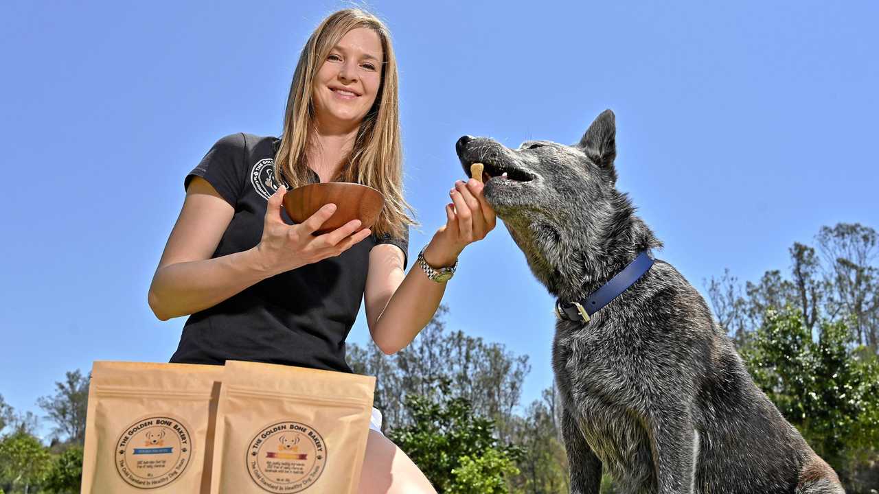 Katharina von Heusinger with Winston. They have started a healthy dog treat bakery out of Borallon Correctional Facility. Picture: Cordell Richardson