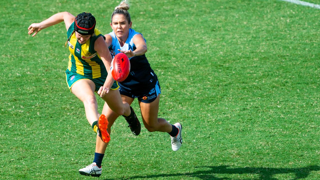 2020-21 NTFL Women's Premier League Grand Final - Darwin Buffettes v PINT Queenants. Claudia Fabris gets a kick off before being chased down. Photograph: Che Chorley