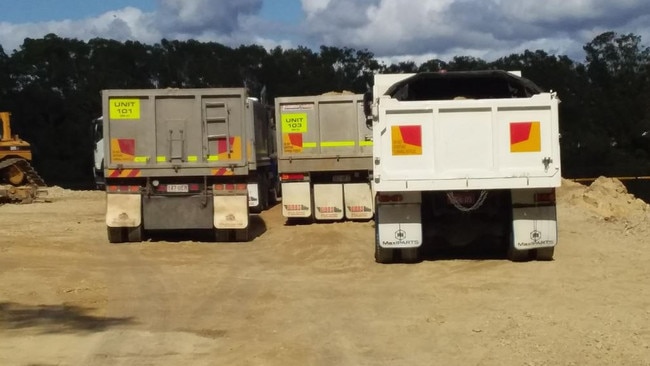 Trucks arriving at Black Swan Lake on the Gold Coast.