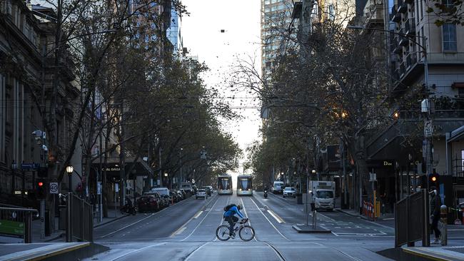 The usually busy Swanston St is quiet as lockdown restrictions take hold in Melbourne. Picture: Daniel Pockett/Getty Images