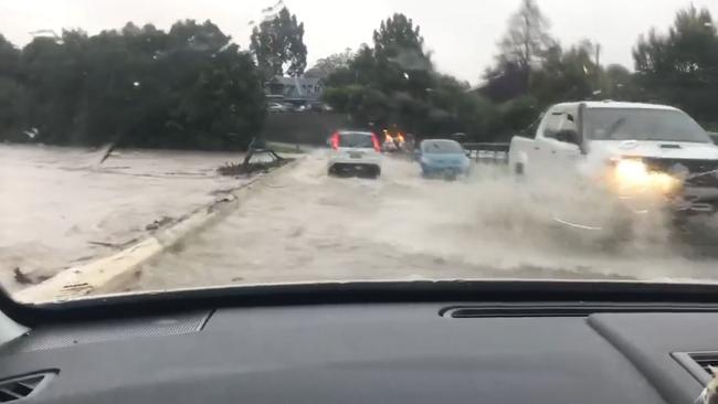 David Forest captured footage of the last cars to cross Lavenders Bridge before it was closed due to flooding on Friday.