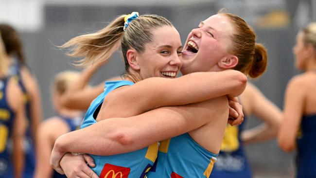 Emily Gilbert (right) celebrates success with the Titans.