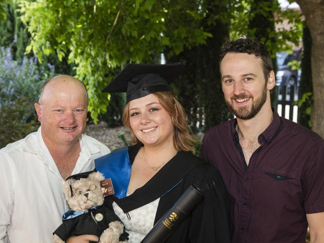 Bachelor of Nursing graduate Courtney Richards with Neale Richards (right) and Ashley Butler at a UniSQ graduation ceremony at Empire Theatres, Tuesday, October 31, 2023. Picture: Kevin Farmer