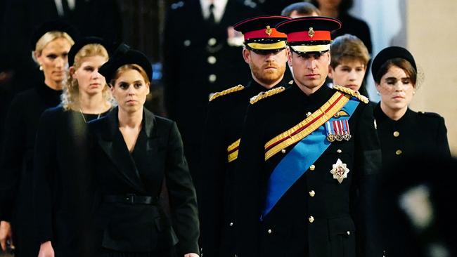 Queen Elizabeth II 's grandchildren (L-R) Zara Tindall, Britain's Lady Louise Windsor, Britain's Princess Beatrice of York, Britain's Prince Harry, Duke of Sussex,, Britain's Prince William, Prince of Wales, James, Viscount Severn and Britain's Princess Eugenie of York arrive to hold a vigil at the coffin of Queen Elizabeth II, lying in state on the catafalque in Westminster Hall, at the Palace of Westminster in London on September 17, 2022, ahead of her funeral on Monday. - Queen Elizabeth II will lie in state in Westminster Hall inside the Palace of Westminster, until 0530 GMT on September 19, a few hours before her funeral, with huge queues expected to file past her coffin to pay their respects. (Photo by Aaron Chown / POOL / AFP)