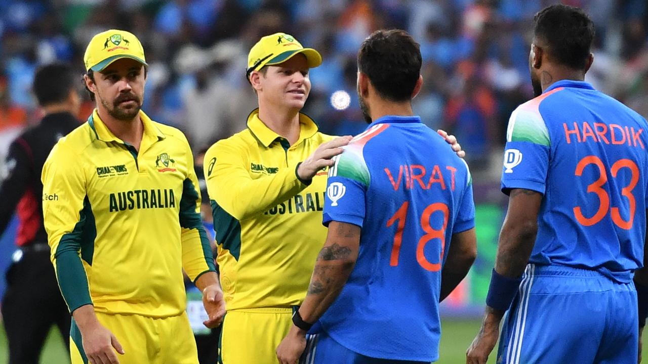 Steve Smith and Virat Kohli share a moment after India’s win over Australia in the Champions Trophy semi-final. (Photo by Ryan LIM / AFP)