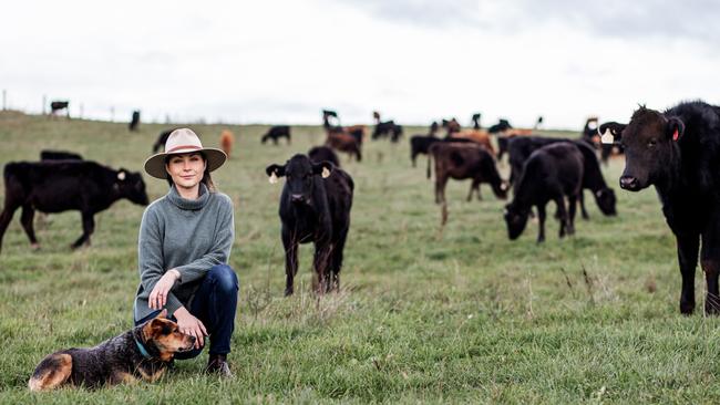 After trading her city lifestyle, Stephanie Trethewey is now happy surrounded by cows on her property at Dunorlan in Tasmania’s north. Picture: Ness Vanderburgh