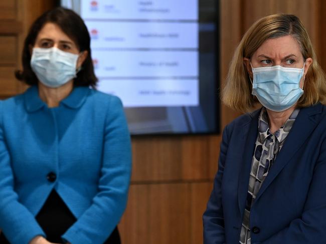 SYDNEY, AUSTRALIA - AUGUST 26: (L-R) NSW Premier Gladys Berejiklian and NSW Chief Health Officer Dr Kerry Chant wear a face mask during a press conference to provide a COVID-19 update on August 26, 2021 in Sydney, Australia. NSW recorded 1029 new locally acquired cases of COVID-19 as the entire state continues in lockdown. (Photo by Bianca De Marchi - Pool/Getty Images)