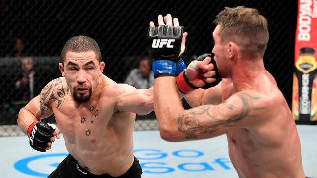 Robert Whittaker landing a blow during UFC 251. Picture: AFP Photo