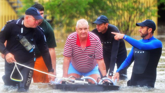 Water Police rescue Rodney Lynne from a Carr Street home in Hermit Park. Picture: Zak Simmonds