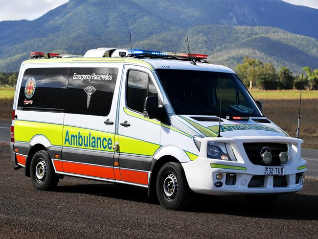 Emergency services attend a fatal car crash on the Bruce Highway, south of Townsville at Mount Surround. Garbage truck driver being looked over by paramedics.  Picture: Alix Sweeney