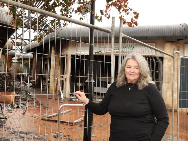 Silver and Sea owner Sabrina Kingsley outside the burnt remains of her Torquay shop. Picture: Alison Wynd