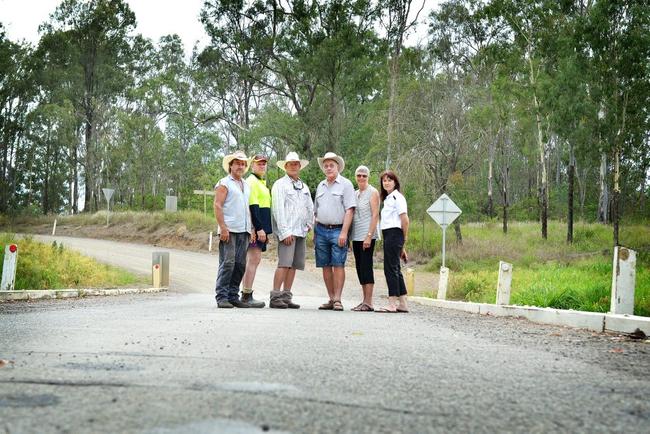 Woolooga residents standing on the Running Creek bridge wanting an upgrade are Phil Stanford, Steve Turner, Sean Barrett, Nevile and Joy Turner and Sharon Turner. Picture: Renee Albrecht