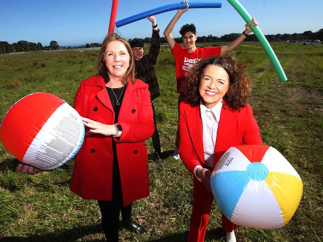 Catherine King, left, and Libby Coker MP, right, with Bellarine swimmers Neo Williams and Jordan Smith. Picture: Alan Barber