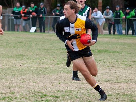 Declan Bird tucks the ball under his arm. Picture: John Stapleton 