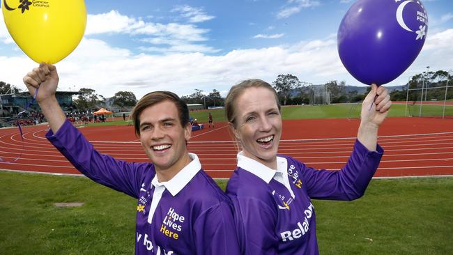 Relay for Life ambassadors Deon Kenzie, left, and Kerry Hore launch next year’s event at the Domain Athletics Centre. Picture: KIM EISZELE