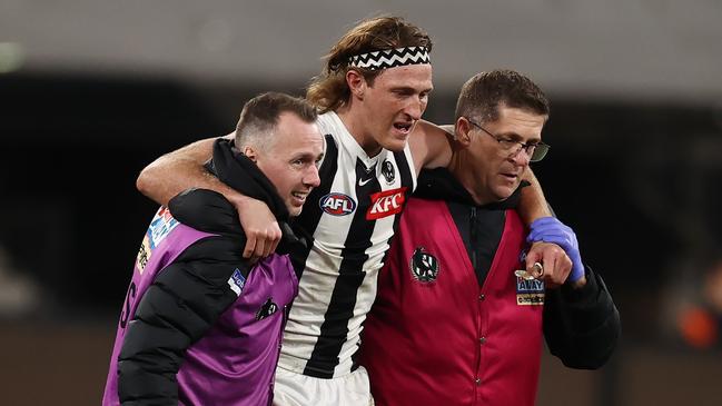 Nathan Murphy is helped off the ground by medicos. Picture: Michael Klein