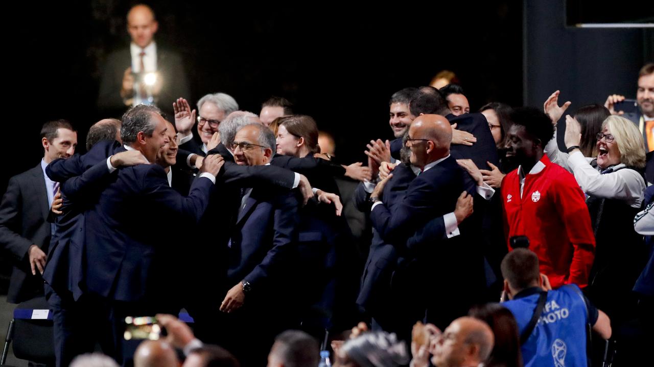 Delegates of Canada, Mexico and the United States celebrate.