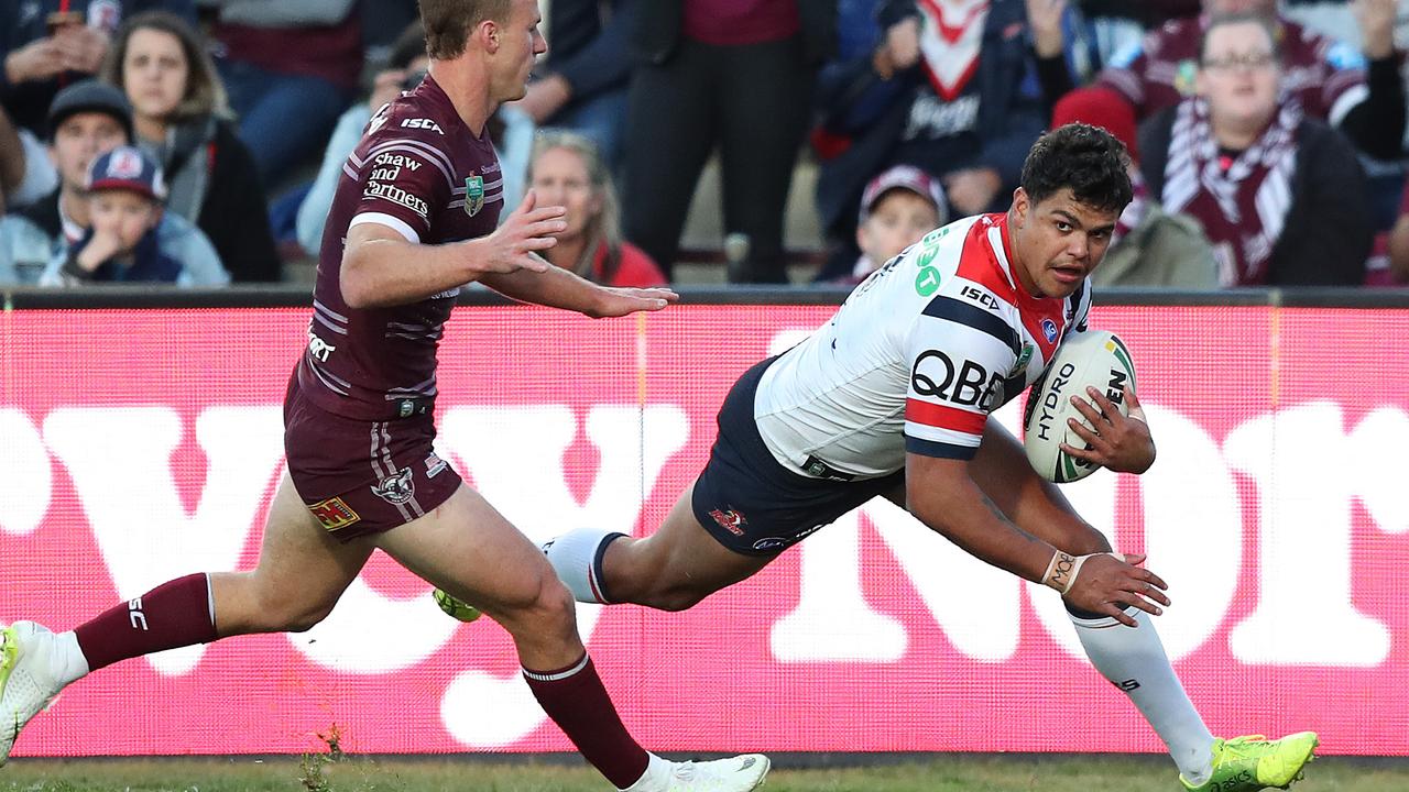 Latrell Mitchell scores a try for the Roosters.