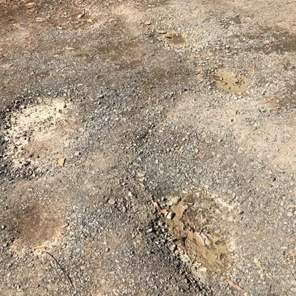 The poor condition of Kinglake West Primary School’s service lane, which runs beside Whittlesea-Kinglake Rd. Picture: Anthony Piovesan