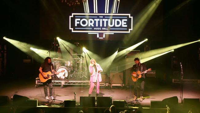 Tia Gostelow with Busby Marou, on stage at The Fortitude Music Hall opening Brisbane, Friday, July 26, 2019. Picture: AAP/Photo Steve Pohlner