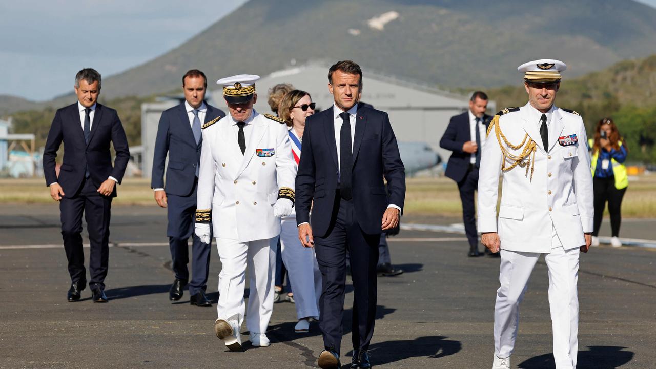 French President Emmanuel Macron (centre) has flown to New Caledonia to deal with the crisis. Picture: Ludovic Marin / POOL / AFP