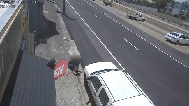 CCTV captures footage of woman falling and injuring herself on Spence St footpath