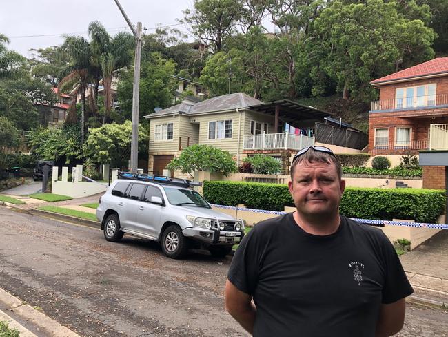 Ian Hughes and his young family of three are not allowed back into their home in Garden St, North Narrabeen, due to dangers of landslips behind the house. Picture: Jim O’Rourke