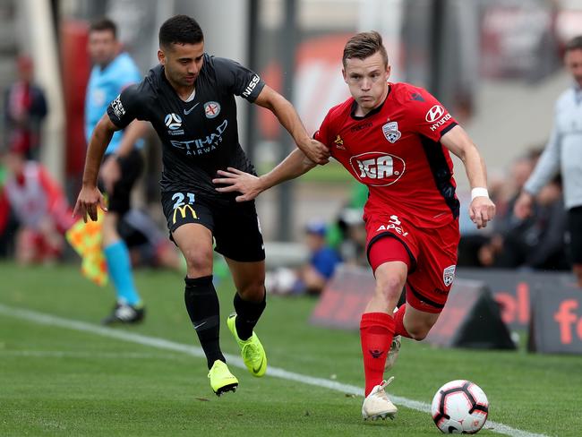 Ramy Najjarine of Melbourne City FC tackles Scott Galloway of Adelaide United during the Round 8 A-League match between Adelaide United and Melbourne City at Coopers Stadium in Adelaide, Sunday, December 16, 2018. (AAP Image/James Elsby) NO ARCHIVING, EDITORIAL USE ONLY