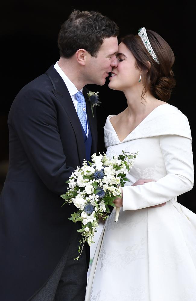 Princess Eugenie of York and her husband Jack Brooksbank kiss on the steps of St George's Chapel after their wedding. Picture: Getty