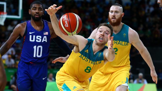 Matthew Dellavedova and Aron Baynes in action during the Rio Olympics 2016 Men's basketball game between the Australian Boomers and the USA Dream Team at Carioca Arena. Picture: Adam Head