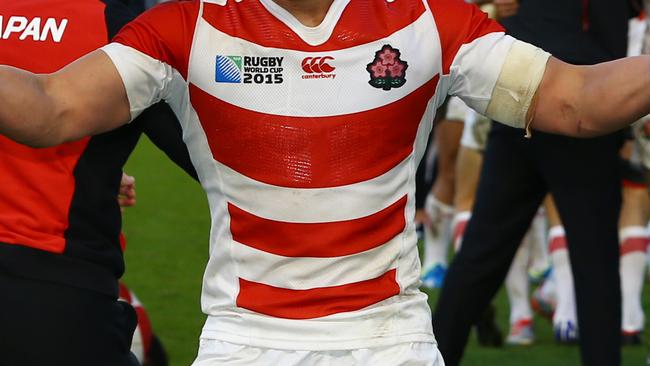 BRIGHTON, ENGLAND - SEPTEMBER 19: Japanese players celebrate their win during the Rugby World Cup 2015 Pool B match between South Africa and Japan at Brighton Community Centre on September 19, 2015 in Brighton, England. (Photo by Steve Haag/Gallo Images/Getty Images)