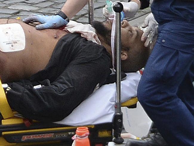 The suspected terrorist on a stretcher outside Parliament. Picture: Stefan Rousseau/PA via AP