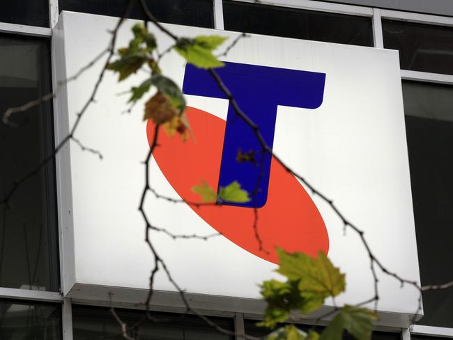 A Telstra logo is seen through a tree branch with only a few leaves on it in Sydney, Australia, Thursday, Aug. 11, 2011. Telstra Corp., Australia's largest telecommunications company, reported a 17 percent fall in annual profit to 3.2 billion Australian dollars (US$3.3 billion). (AP Photo/Rick Rycroft) Picture: Ap