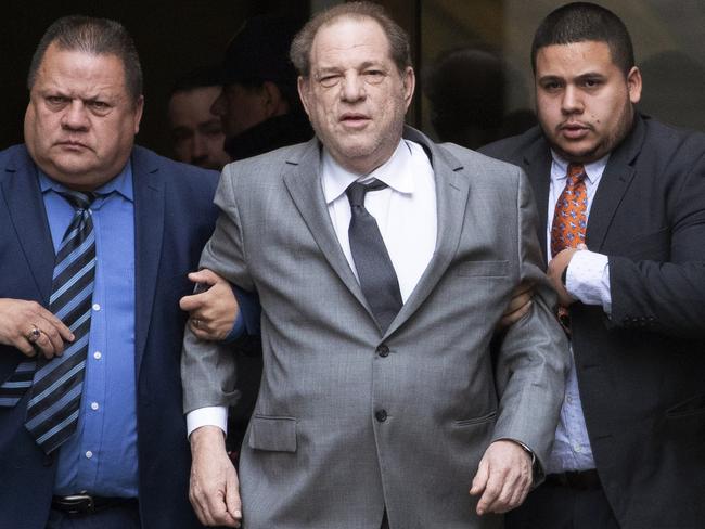 Harvey Weinstein (centre) leaving court following a bail hearing in New York. Picture: Mark Lennihan