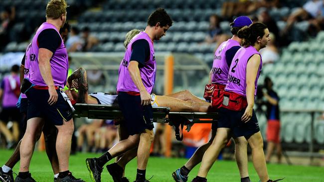 Adelaide Crow Rhiannon Metcalfe is stretchered off after rupturing her ACL in Darwin earlier this year. Picture: Justin Kennedy