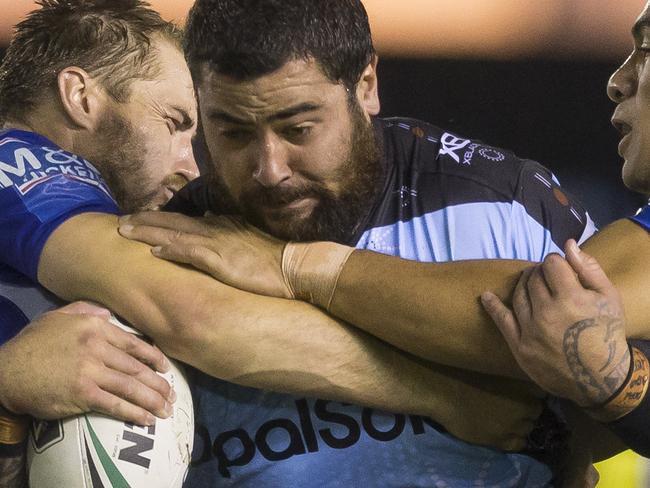 Andrew Fifita of the Sharks is tackled during the Round 11 NRL match between the Cronulla-Sutherland Sharks and the Canterbury-Bankstown Bulldogs at Southern Cross Group Stadium in Sydney, Sunday, May 20, 2018. (AAP Image/Craig Golding) NO ARCHIVING, EDITORIAL USE ONLY