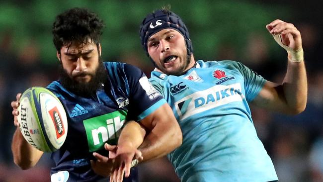 Akira Ioane of the Blues (left) and Michael Wells of the Waratahs contest a lineout on Saturday night.