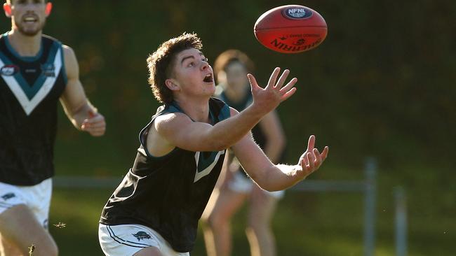 NFL: Bailey Macleod keeps his eye on the ball for Laurimar. Picture: Hamish Blair