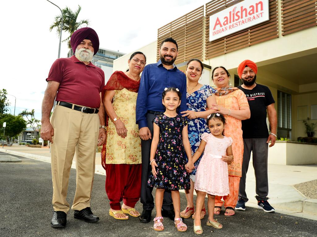 Inderdeep Singh Tamber (centre) celebrating the opening of Aalishan Indian Restaurant on Palmer St with his family in 2020.