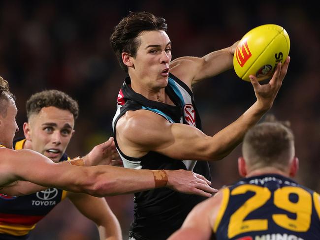 ADELAIDE, AUSTRALIA - MAY 02: Connor Rozee of the Power handpasses the ball during the 2024 AFL Round 08 match between the Adelaide Crows and the Port Adelaide Power at Adelaide Oval on May 02, 2024 in Adelaide, Australia. (Photo by Sarah Reed/AFL Photos via Getty Images)