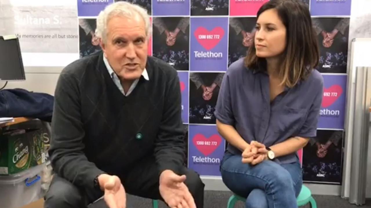 Dr Chris Higgins with his daughter Missy in a photo from the Asylum Seeker Resource Centre (ASRC) Facebook video. Picture: Facebook.