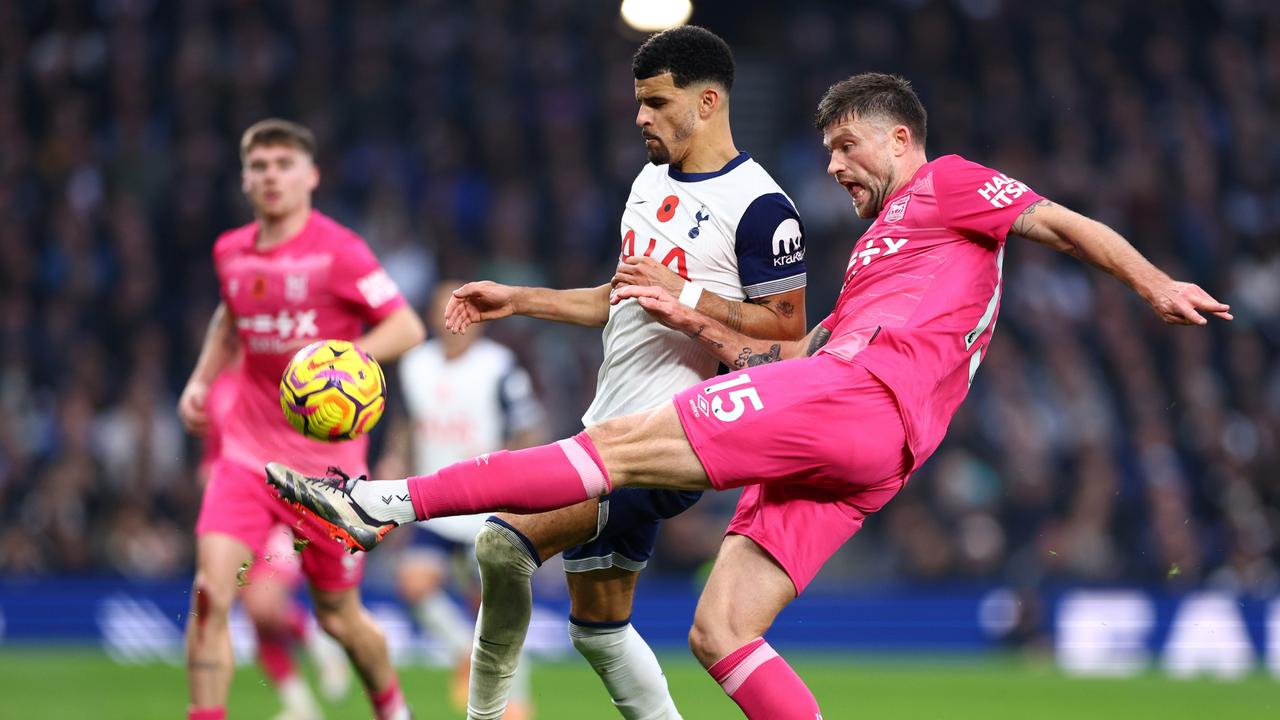 Burgess tackles Tottenham Hotspur striker Dominic Solanke during Ipswich Town’s breakthrough 2-1 Premier League victory on Sunday. Picture: Clive Rose / Getty Images