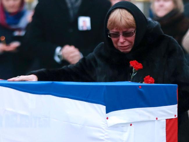 Marina Davydova Karlova, widow of late Russian Ambassador to Turkey Andrey Karlov, grieves over his coffin. Picture: AFP/Adem Altan