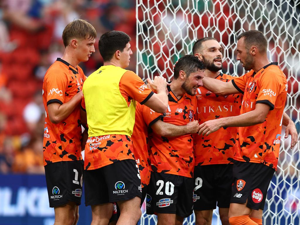 Marco Rojas (centre) is congratulated by his Brisbane Roar teammates after scoring against Melbourne Victory. Picture: Chris Hyde/Getty Images