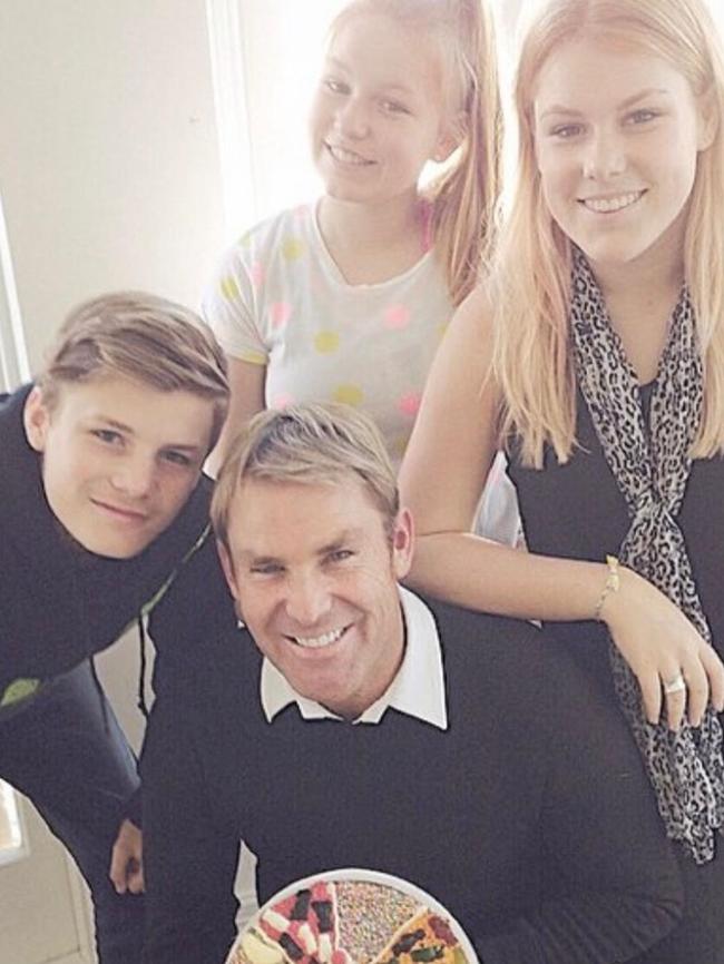 Warne and his children.