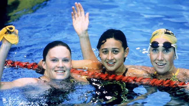 Julie McDonald, silver, Hayley Lewis, gold and Janelle Elford, bronze celebrating after a clean sweep in the 400m freestyle.